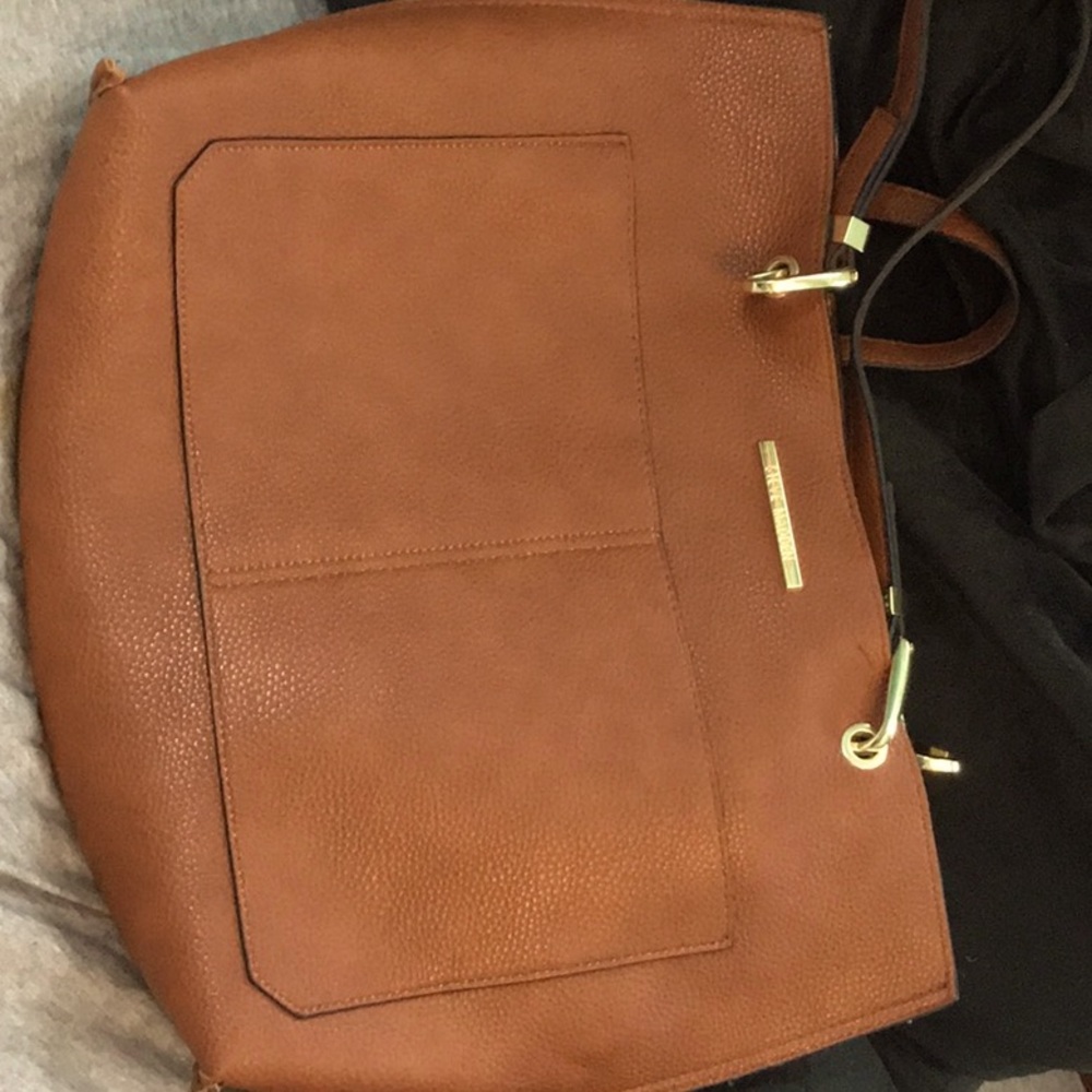 It’s a 15 x 11 tan Steve Madden purse
